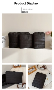 Detail view of black quilted shockproof laptop sleeve with stitching and top zipper