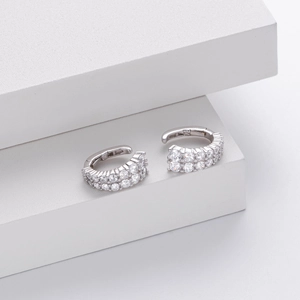 Detailed macro view of S925 sterling silver earrings with double rows of pave-set zircons
