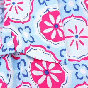 Women's V-neck geometric print shirt dress in light blue with pink floral patterns