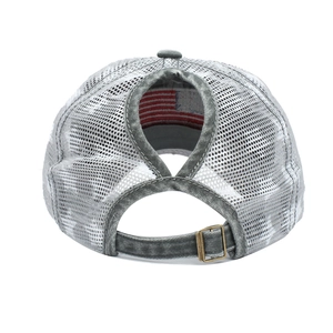 Detail view of the criss-cross high ponytail opening and mesh on washed grey baseball cap