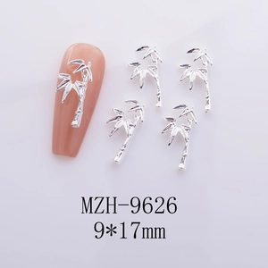 Silver bamboo nail charm on nude manicure display with 9x17mm size specifications