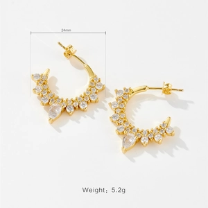 Detail view of 24mm irregular C-hoop gold earrings with zircon stones and weight specs