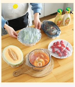 Close-up of elastic PE plastic food covers stretching over various kitchen containers
