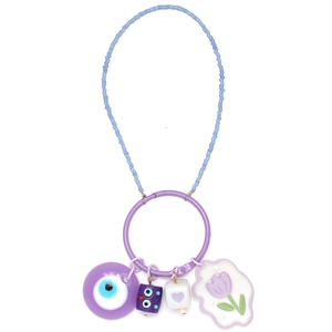 Close-up of beaded keychain featuring purple evil eye and heart charms on white background
