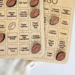 Detail showing carved wooden bingo chips and game boards with football terminology