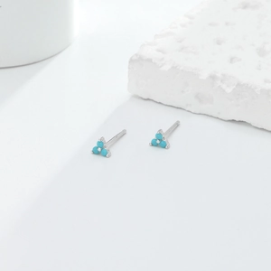 Macro detail of S925 sterling silver triangle earrings with blue turquoise stones