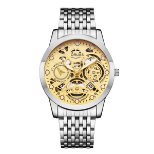 Detail view of the silver stainless steel watch with golden hollow skeleton mechanical dial