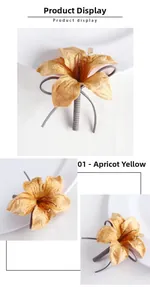 Detail of handmade apricot lily boutonniere with metallic sheen and ribbon stem