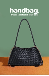 Detail of black woven leather handbag showing intricate Intrecciato craft and strap