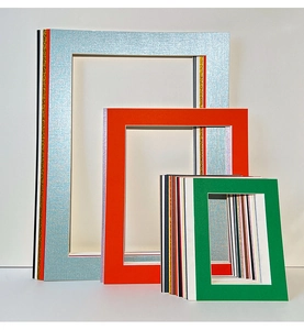 Detail of multi-size cardstock photo mats with beveled edges in various colors and textures