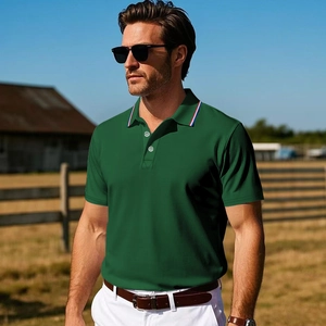 Detail of dark green polo shirt featuring a striped collar and metallic buttons