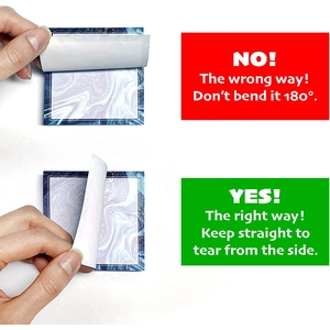Correct way to tear marble sticky notes showing how to keep the paper straight