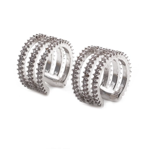 Minimalist silver multi-layer clip-on earrings with shimmering rhinestones on white background