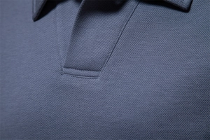 Close-up of gray-blue pique cotton polo shirt collar and breathable mesh texture