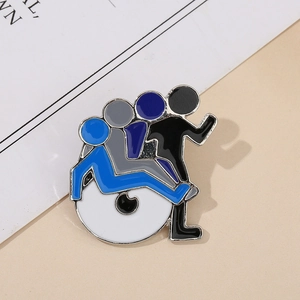 Macro detail of abstract silhouette enamel pin featuring blue and grey layered human figures