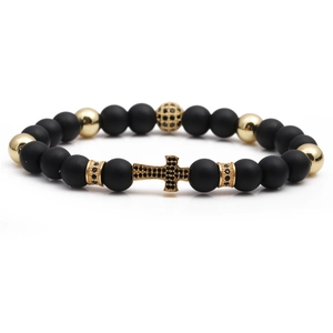 Detailed shot of men's matte black beads and gold cross with black micro-inlay accents
