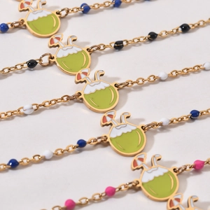 Golden stainless steel beach bracelet with coconut charm and multi-colored beads