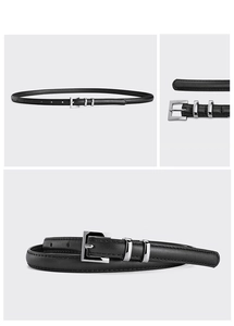 Detail of black thin leather belt showing silver square buckle and stitched texture