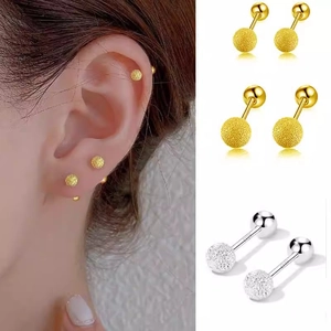 Detailed macro view of S925 sterling silver frosted ball stud earrings with screw back design