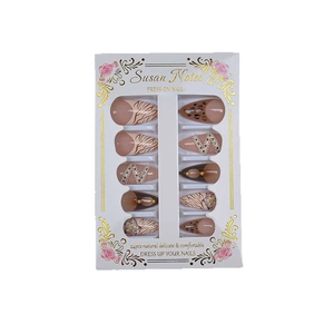 Press-on nails featuring French leopard print, 3D floral designs, and gold bead chains