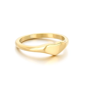 Minimalist polished gold heart signet ring for women with high-shine metallic finish