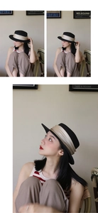 Detail of elegant black flat top straw boater hat with champagne satin ribbon trim