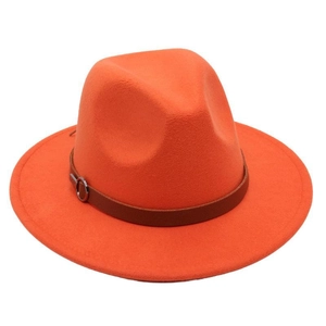 Detail of bright orange wool fedora featuring a dark brown leather belt and metal buckle