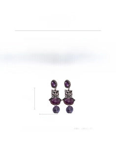 Detailed view of vintage cat drop earrings with purple resin stones and rhinestones
