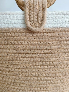Handwoven beige and white cotton rope tote bag with detailed twill texture