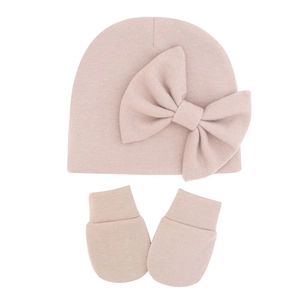 Knitted baby hat and scratch mittens set with large bow decoration in soft apricot pink