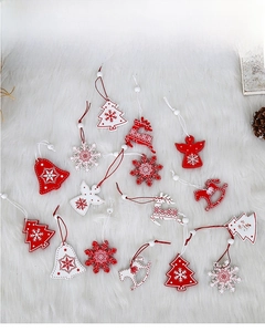 Detail of wooden Christmas ornaments featuring trees, deer, and stars on plush background