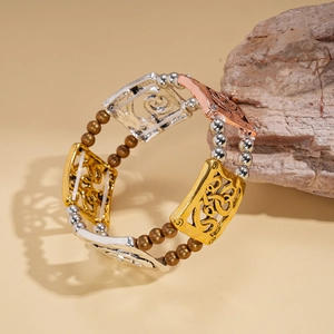 Detail of bohemian stretch bracelet featuring multi-color metal beads and hollow square charms