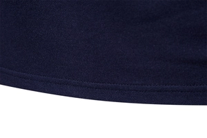 Close-up of navy blue polo shirt hem featuring breathable knit mesh and double stitching