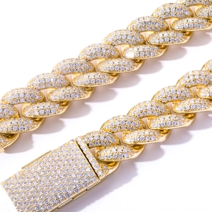 Close-up of 20mm gold Cuban link bracelet with micro-paved rhinestones on white background