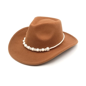 Brown wool cowboy hat for women with elegant pearl flower band on a white background