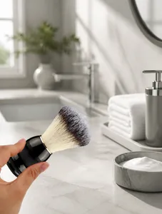 Close-up of soft bristled shaving brush with ergonomic handle and dual-tone synthetic hair