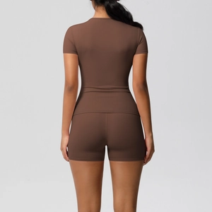 Women's dark brown nylon yoga set with tight short sleeve top and high waist sports shorts