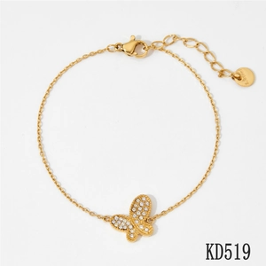 Close-up of gold butterfly bracelet showing micro-paved crystals and S.Steel engraving