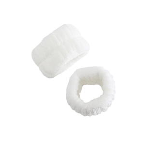 Close-up of soft white absorbent wristbands for washing face and skincare routine