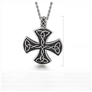 Macro detail of stainless steel Celtic cross pendant with vintage punk casting texture