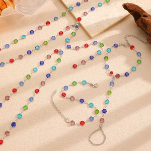 Detail view of colorful heart crystal necklaces and bracelets set in bohemian style