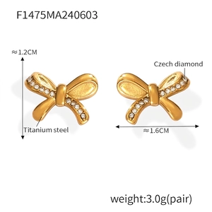 Detailed size and material specs for gold bow earrings with titanium and Czech diamonds