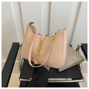 Detail of beige hobo bag with smooth leather finish and gold chain strap accent