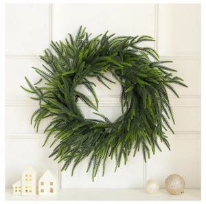 Close-up of realistic green pine needles on Christmas wreath for home wall decoration