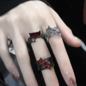 Gothic thorn ring set featuring black and silver finishes with red and clear zircons