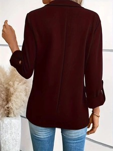 Back view of burgundy long sleeve blazer showing tailored seams and buttoned cuffs
