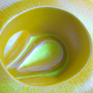 Macro shot of the woven texture and metallic pearlescent coating on the yellow cowboy hat