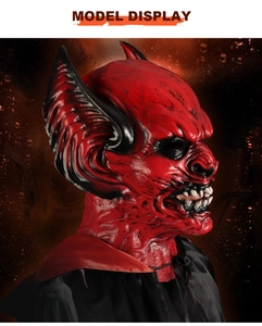 Side view of red demon latex mask with intricate skin texture and horns for Halloween