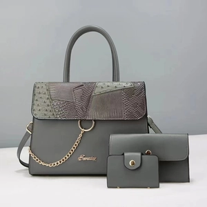 Three-piece gray women handbag set with textured patchwork and decorative metal chain