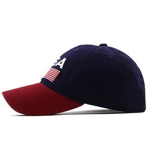Close-up of USA embroidery on navy cotton baseball cap with red reinforced brim